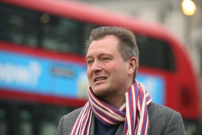 Richard Ratcliffe, speaks to the media, outside the Houses of Parliament in London, ahead of his wife Nazanin Zaghari-Ratcliffe's return, in London, Wednesday, March 16, 2022. Zaghari-Ratcliffe, a British charity worker who has been detained in Iran for almost six years, is flying home from Tehran after the U.K. government settled a decades-old debt to Iran. Zaghari-Ratcliffe and another dual national, Anoush Ashoori, who was detained in Tehran in 2017, boarded a plane from Tehran’s Mehrabad International Airport after the deal was struck. (James Manning/PA via AP)