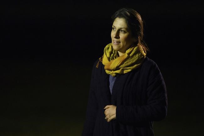 Nazanin Zaghari-Ratcliffe, who was freed from Iran, arrives at RAF Brize Norton in Brize Norton, England Thursday, March 17, 2022. Two British citizens who had been jailed in Iran for more than five years, charity worker Zaghari-Ratcliffe and retired civil engineer Anoosheh Ashoori, returned to British soil Thursday morning after the U.K. settled a decades-old debt to Iran. (Leon Neal/Pool Photo via AP)