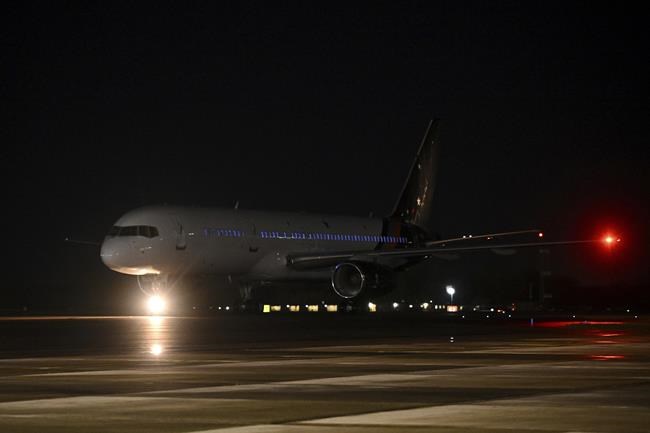 The plane carrying Nazanin Zaghari-Ratcliffe and Anoosheh Ashoori, who were freed from Iran, lands at RAF Brize Norton in Brize Norton, England Thursday, March 17, 2022. The charity worker and retired civil engineer had been released Wednesday after the U.K. government settled a decades-old debt to Iran. (Leon Neal/Pool Photo via AP)