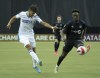 Cruz Azul forward Milton Caraglio, left, challenges CF MontrŽal midfielder Isma‘l KonŽ (28) during first half of the second leg CONCACAF Champions League quarter-final action Wednesday, March 16, 2022 in Montreal. THE CANADIAN PRESS/Ryan Remiorz