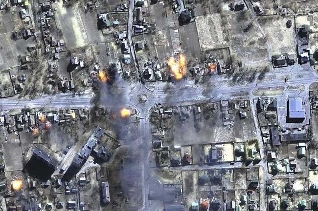 This satellite image provided by Maxar Technologies shows burning buildings in a residential area in northeast Chernihiv, Ukraine on Wednesday, March 16, 2022. (Maxar Technologies via AP)