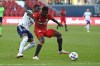 Toronto FC's Kemar Lawrence, right, keeps the ball aways from D.C. United's Nigel Robertha during first half MLS soccer action in Toronto on Sunday, Nov. 7, 2021. Toronto FC has confirmed the departure of the Jamaican international defender Kemar Lawrence via trade with Minnesota United.THE CANADIAN PRESS/Jon Blacker