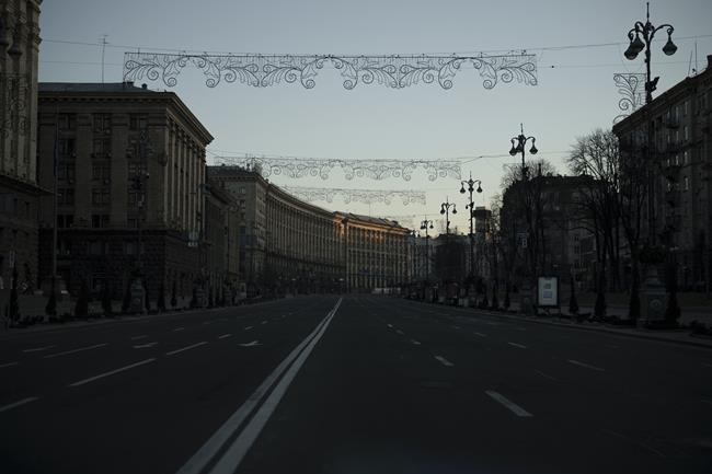 A deserted street during curfew in downtown Kyiv, Ukraine, Friday, March 18, 2022. Russian forces pressed their assault on Ukrainian cities Friday, with new missile strikes and shelling on the edges of the capital Kyiv and the western city of Lviv, as world leaders pushed for an investigation of the Kremlin’s repeated attacks on civilian targets, including schools, hospitals and residential areas. (AP Photo/Felipe Dana)