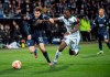 Bochum's Elvis Rexhbecaj and Monchengladbach's Kouadio Kone, right, battle for the ball during the Bundesliga soccer match between VfL Bochum - Borussia M'nchengladbach at the Vonovia Ruhrstadion in Bochum, Germany, Friday March 18, 2022. (Bernd Thissen/dpa via AP)