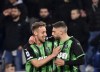 Sassuolo's Domenico Berardi, right, celebrates scoring during the Serie A soccer match between Sassuolo and Spezia at Mapei stadium in Reggio Emilia, Italy, Friday March 18, 2022. (Massimo Paolone/LaPresse via AP)