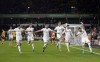 Leeds United's Luke Ayling, right, celebrates scoring with teammates during the English Premier League soccer match at Molineux Stadium, Wolverhampton, England, Friday March 18, 2022. (Nick Potts/PA via AP)
