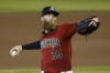 FILE - Arizona Diamondbacks pitcher Archie Bradley throws a pitch during an intrasquad game at Chase Field in Phoenix, in this Monday, July 6, 2020, file photo. Reliever Right-hander Archie Bradley has agreed to a $3.75 million, one-year deal to bolster the Los Angeles Angels' bullpen. Bradley went through his first workout with the Angels on Friday, March 18, 2022. (AP Photo/Ross D. Franklin, File)