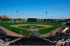Oakland Athletics players take live batting practice during a baseball spring training workout Wednesday, March 16, 2022, in Mesa, Ariz. (AP Photo/Ross D. Franklin)