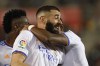 Real Madrid's Karim Benzema celebrates after scoring his side's third goal during a Spanish La Liga soccer match between Mallorca and Real Madrid in Palma de Mallorca, Spain, Monday, March 14, 2022. (AP Photo/Francisco Ubilla)