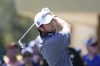 Davis Riley watches his tee shot on the second hole during the third round of the Valspar Championship golf tournament, Saturday, March 19, 2022, at Innisbrook in Palm Harbor, Fla (AP Photo/Scott Audette)