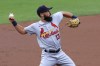 FILE - St. Louis Cardinals' Matt Carpenter fields the ball during a baseball game against the Cincinnati Reds in Cincinnati, Sept. 2, 2020. Veteran infielder Carpenter has signed a minor league contract with the Texas Rangers. (AP Photo/Aaron Doster, File)