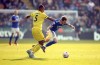 Brentford's Ethan Pinnock, left, fouls Leicester City's James Maddison during their English Premier League soccer match at the King Power Stadium, Leicester, England, Sunday March 20, 2022. (Nigel French/PA via AP)