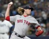 FILE - Boston Red Sox pitcher Garrett Richards throws to a Tampa Bay Rays batter during the second inning of Game 1 of a baseball American League Division Series, Oct. 7, 2021, in St. Petersburg, Fla. The Texas Rangers on Sunday, March 20, 2022, officially announced the signing of free agent right-handed pitcher Richards to a one-year contract with a club option for 2023. (AP Photo/Steve Helber, File)