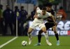 Marseille's William Saliba, front, and Nice's Khephren Thuram battle for the ball during a French League One soccer match between Olympique de Marseille and OGC Nice at Orange Velodrome in Marseille, France, Sunday, March 20, 2022.(AP Photo/Daniel Cole)
