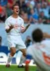 FILE - Marc Overmars of the Netherlands, left, reacts after he missed a chance during the Euro 2004 semi final soccer match between Portugal and the Netherlands at the Jose Alvalade stadium in Lisbon, Portugal, on June 30, 2004. Former Dutch soccer star Marc Overmars was appointed Monday as sports director of Belgian club Royal Antwerp only weeks after he abruptly quit Dutch champion Ajax over accusations of sex harassment. Last month, Overmars relinquished his sports director role at Ajax after apologizing for sending inappropriate messages to female colleagues. (AP Photo/Frank Augstein, File)
