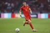 FILE - Wales' Gareth Bale runs with the ball during the Euro 2020 soccer championship round of 16 match between Wales and Denmark at the Johan Cruyff ArenA in Amsterdam, Netherlands, on June 26, 2021. Gareth Bale has linked up with Wales' national team ahead of its World Cup qualifying playoff against Austria. That's despite missing Real Madrid's match against fierce rival Barcelona in the Spanish league on Sunday because he wasn't ready to play according to Madrid coach Carlo Ancelotti. (Dean Mouhtaropoulos/Pool via AP, File)