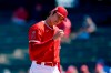 Los Angeles Angels pitcher Shohei Ohtani, of Japan, examines a baseball before throwing against the Kansas City Royals during the first inning of a spring training baseball game Monday, March 21, 2022, in Tempe, Ariz. (AP Photo/Ross D. Franklin)