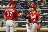 Cincinnati Reds' Tyler Stephenson (37) and Jonathan India (6) celebrate after scoring off India's two-run home run in the ninth inning of the baseball game against the New York Mets, July 30, 2021, in New York. Jonathan India and Tyler Stephenson pledge to avoid the “sophomore jinx” by setting new goals for the 2022 season taking on more responsibility in Reds' new lineup. India exceeded expectations by winning the Reds’ second base job and then National League Rookie of the Year. Stephenson showed that he could Cincinnati’s everyday catcher. (AP Photo/Mary Altaffer)