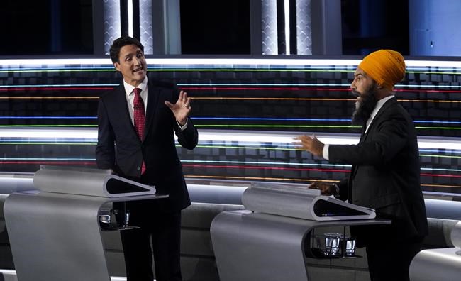 Liberal Leader Justin Trudeau, left, and NDP Leader Jagmeet Singh, take part in the federal election English-language Leaders debate in Gatineau, Que., on Thursday, Sept. 9, 2021. A new agreement between the federal Liberal government and New Democrats has something important to offer the next Conservative leader: Time. THE CANADIAN PRESS/Adrian Wyld
