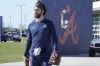 Atlanta Braves shortstop Dansby Swanson walks to the batting cages for spring training baseball practice at CoolToday Park on Monday, March 14, 2022, in North Port, Fla. (AP Photo/Steve Helber)