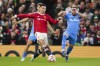 Manchester United's Cristiano Ronaldo and Atletico Madrid's Hector Herrera, right, battle for the ball during the Champions League round of 16, second leg soccer match between Manchester United and Atletico Madrid at Old Trafford, Manchester, England, Tuesday, March 15, 2022. (AP Photo/Dave Thompson)