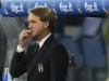 FILE - Italy coach Roberto Mancini stands in the dugout before the World Cup 2022 group C qualifying soccer match between Italy and Switzerland at Rome's Olympic stadium, on Nov. 12, 2021. With Italy’s darkest moment on many people’s minds, coach Roberto Mancini is not thinking about the unthinkable but about winning the World Cup in Qatar. Italy failed to qualify for the 2018 tournament. Missing two straight World Cups would be an unprecedented low point for the four-time champion, especially less than a year after winning the European Championship.(AP Photo/Gregorio Borgia)