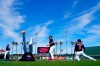 Cleveland Guardians' Jose Ramirez, left, Richard Palacios, second from left, Bobby Bradley, and Andres Gimenez (0) warm up prior to the team's spring training baseball game against the San Diego Padres on Tuesday, March 22, 2022, in Goodyear, Ariz. (AP Photo/Ross D. Franklin)