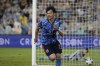Japan's Kaoru Mitoma celebrates after scoring a goal during the World Cup 2022 play-off soccer match between Japan and Australia at Stadium Australia in Sydney, Thursday, March 24, 2022. (AP Photo/Mark Baker)