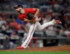 FILE - Atlanta Braves pitcher Spencer Strider works against the New York Mets in the seventh inning of a baseball game Friday, Oct. 1, 2021, in Atlanta. Hard-throwing rookie right-hander Spencer Strider, who made his major league debut with Atlanta late last season as a reliever, is being considered for one of the open spots in the Braves rotation. General manager Alex Anthopoulos said Thursday, March 24, 2022, Kyle Wright and Huascar Ynoa “are the frontrunners” for the last two spots in the rotation. Anthopoulos included Strider, regarded as a possible future closer, among others in the competition. (AP Photo/Ben Margot, File)