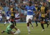 FILE- Progres' goalkeeper Sebastien Flauss, left, goes in for a save against Rangers' Jermain Defoe during a Europa League soccer match between Progres Niederkorn and Rangers at the Josy Barthel stadium in Luxembourg, on Aug. 1, 2019. Former England striker Jermain Defoe has announced his retirement from soccer at the age of 39. It ends a 22-year professional career. Defoe scored 20 goals in 57 games for his country and was in England’s squad for the World Cup in 2010 and the European Championship in 2012. (AP Photo/Francisco Seco, File)