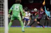 United States' Ricardo Pepi, center, and Mexico's Cesar Montes (19) compete for the ball during a qualifying soccer match for the FIFA World Cup Qatar 2022 at Azteca stadium in Mexico City, Thursday, March 24, 2022. (AP Photo/Eduardo Verdugo)