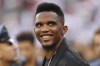 FILE - Soccer player Samuel Eto'o watches warmups before an International Champions Cup soccer match between Atletico Madrid and Real Madrid, Friday, July 26, 2019, in East Rutherford, N.J. Atletico Madrid won 7-3. It was a surprise when Samuel Eto'o announced he was standing as a candidate to be president of the Cameroon soccer federation. And even more of a shock when he won last December. The former Barcelona and Inter Milan striker has now set himself the task of fixing his country's broken domestic soccer structure. (AP Photo/Steve Luciano, File)