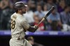 San Diego Padres' Tommy Pham watches his solo home run off Colorado Rockies starting pitcher German Marquez during the seventh inning of a baseball game Tuesday, Aug. 17, 2021, in Denver. Cincinnati Reds manager David Bell said Saturday, March 26, 2022, that newly-signed outfielder Tommy Pham “will be a big part of our lineup.” AP Photo/David Zalubowski, File)