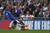 England's Mason Mount, top, is challenged by Switzerland's Manuel Akanji during an international soccer match between England and Switzerland at Wembley Stadium in London, Saturday, March 26, 2022. (AP Photo/Alastair Grant)