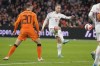 Denmark's Christian Eriksen, right, kicks the ball as Netherlands' Teun Koopmeiners, left, watches during the international friendly soccer match between the Netherlands and Denmark at the Johan Cruyff ArenA in Amsterdam, Netherlands, Saturday, March 26, 2022. (AP Photo/Peter Dejong)