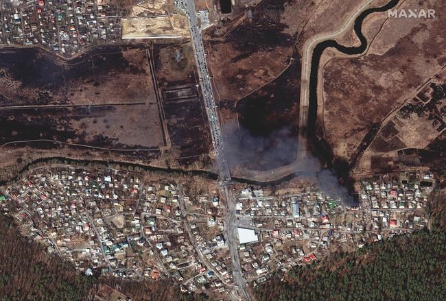 This satellite image provided by Maxar Technologies shows an overview of buildings near the Irpin River, Irpin, Ukraine, during the Russian invasion on Friday March 25, 2022. (Satellite image ©2022 Maxar Technologies via AP)