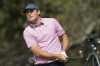 Scottie Scheffler watches his tee shot on the 10th hole in the semifinal round of the Dell Technologies Match Play Championship golf tournament, Sunday, March 27, 2022, in Austin, Texas. (AP Photo/Tony Gutierrez)
