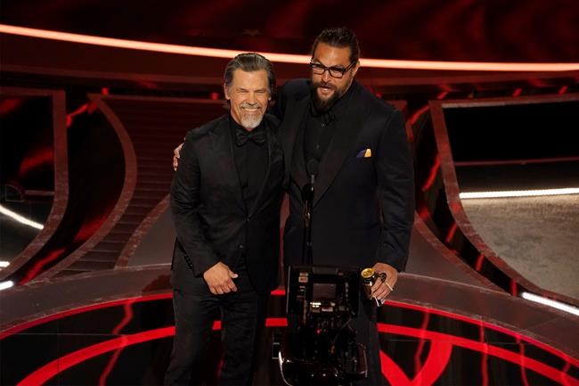 Josh Brolin, left, and Jason Momoa present the award for best sound at the Oscars on Sunday, March 27, 2022, at the Dolby Theatre in Los Angeles. (AP Photo/Chris Pizzello)