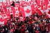 Fans cheer and wave Canadian flags before the start of the Canada-Jamaica CONCACAF World Cup soccer qualifying action in Toronto on Sunday, March 27, 2022.&nbsp;Canadian soccer fans rejoiced upon seeing Canada's men's soccer team clinch a berth in the 2022 World Cup in Qatar after a 4-0 win over Jamaica Sunday at BMO Field. THE CANADIAN PRESS/Frank Gunn