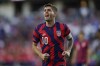 United States' Christian Pulisic reacts during the first half of a FIFA World Cup qualifying soccer match against Panama, Sunday, March 27, 2022, in Orlando, Fla. (AP Photo/Julio Cortez)