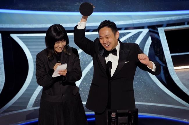 Ryusuke Hamaguchi accepts the award for