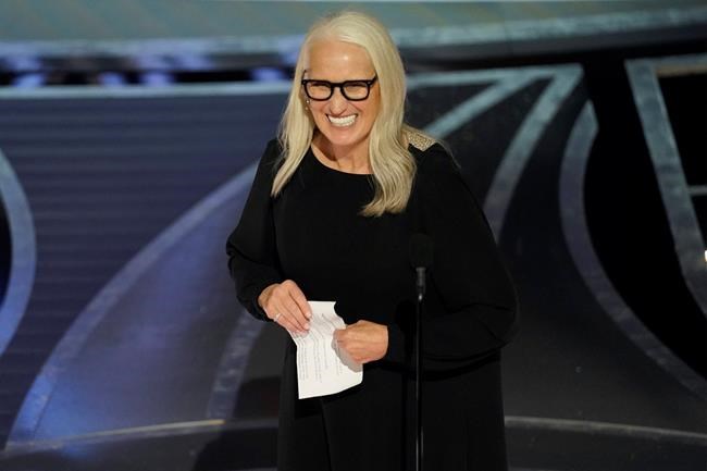 Jane Campion accepts the award for best director for