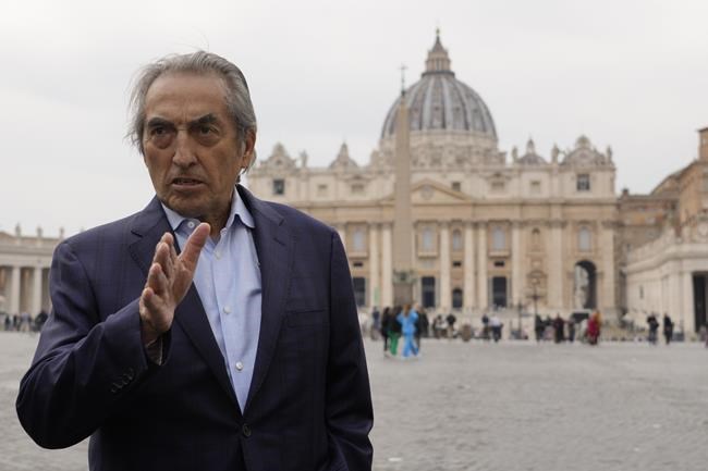 Former national chief of the Assembly of First Nations, Native Canadian Phil Fontaine, answers question during an interview with the Associated Press outside the St. Peter's Square at the Vatican, Sunday, March 27, 2022. A Canadian indigenous delegations is scheduled to have a week of meetings with Pope Francis at the Vatican. (AP Photo/Gregorio Borgia)