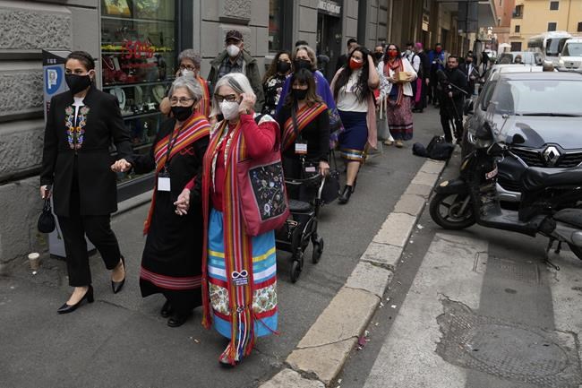 The President of the Metis community, Cassidy Caron, left, leaves the hotel with a Metis National Council delegation to meet with Pope Francis in Rome, Monday, March 28, 2022. A Canadian indigenous delegations is scheduled to have a week of meetings with Pope Francis at the Vatican. (AP Photo/Gregorio Borgia)