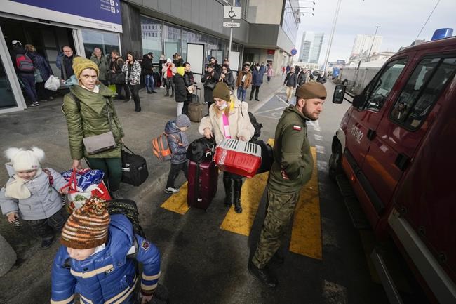 Ukrainian refugees wait for a transport at the central train station in Warsaw, Poland, Sunday, March 27, 2022. More than 3.7 million people have fled the war so far, Europe’s largest exodus since World War II. (AP Photo/Czarek Sokolowski)