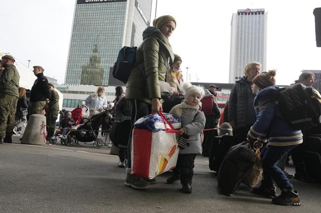 Ukrainian refugees wait for a transport at the central train station in Warsaw, Poland, Sunday, March 27, 2022. More than 3.7 million people have fled the war so far, Europe's largest exodus since the Second World War. Immigration Minister Sean Fraser says the government will help Ukrainians coming to Canada find a job and learn to speak English or French. THE CANADIAN PRESS/AP Photo-Czarek Sokolowski