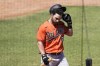 Baltimore Orioles' Ryan McKenna walks to the dugout after striking out during the fifth inning of a spring training baseball game against the Philadelphia Phillies, Monday, March 28, 2022, in Clearwater, Fla. (AP Photo/Lynne Sladky)