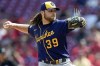 FILE - Milwaukee Brewers starting pitcher Corbin Burnes throws during the ninth inning of the team's baseball game against the Cincinnati Reds in Cincinnati, on July 18, 2021. Burnes faces a major challenge trying to improve upon a spectacular 2021 season that earned him the NL Cy Young Award. (AP Photo/Bryan Woolston, File)