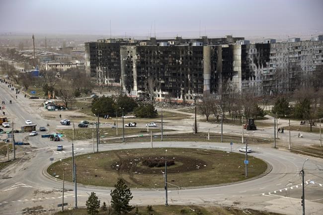 Damage is seen on apartment buildings after shelling from fighting on the outskirts of Mariupol, Ukraine, in territory under control of the separatist government of the Donetsk People's Republic, on Tuesday, March 29, 2022. (AP Photo/Alexei Alexandrov)