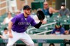 Colorado Rockies first baseman C.J. Cron reaches to make a catch at first base to get Texas Rangers' Andy Ibanez out during the second inning of a spring training baseball game Saturday, March 26, 2022, in Scottsdale, Ariz. (AP Photo/Ross D. Franklin)